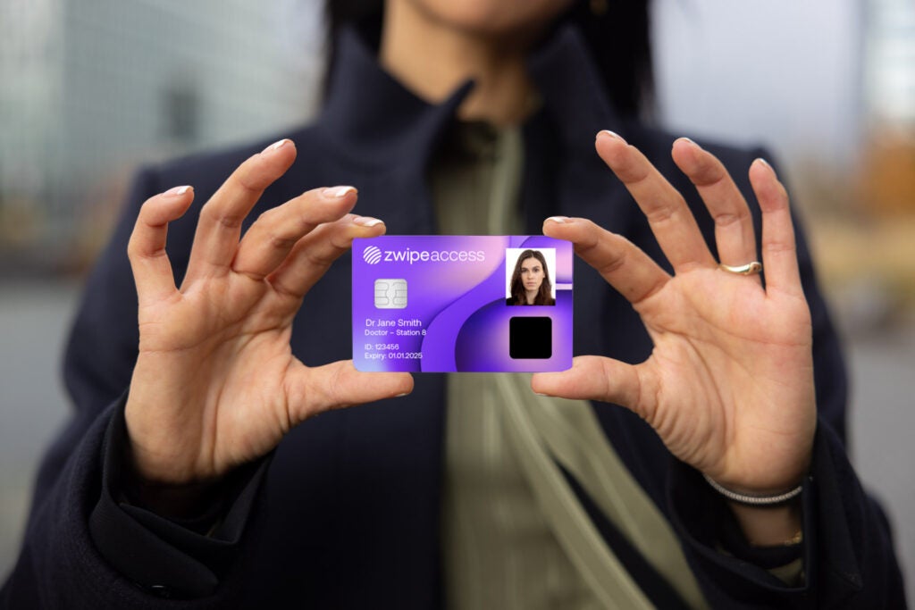 mocjup showing a person holding a zwipe biometric card which includes photo ID and personal details