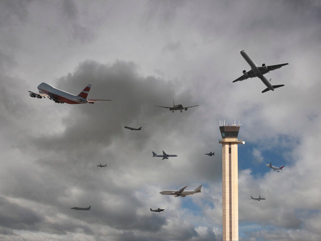 An airport control tower is surrounded by aircraft in UK airspace