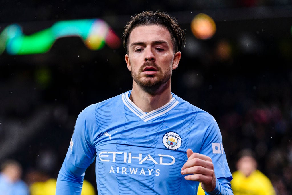 Manchester City player Jack Grealish wearing a amtch shirt featuring the Etihad Airways Logo. Qatar Airways.