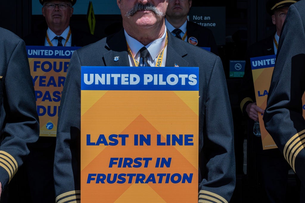 United Airline pilots picketing during a national strike. The pilot's union agreed a pay deal with the airline in September.