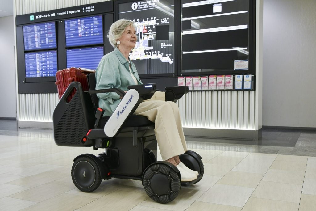 A WHILL Autonomous mobility device, which looks like a wheelchair, can improve airport accessibility for senior travellers