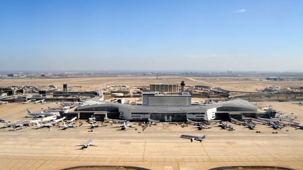 A view of Dallas Fort Worth International Airport with planes waiting at gates