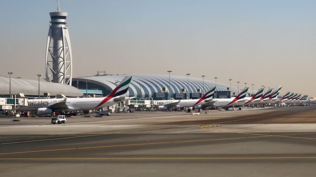 A line of Emirates airline aircraft on the tarmac outside of Dubai International Airport